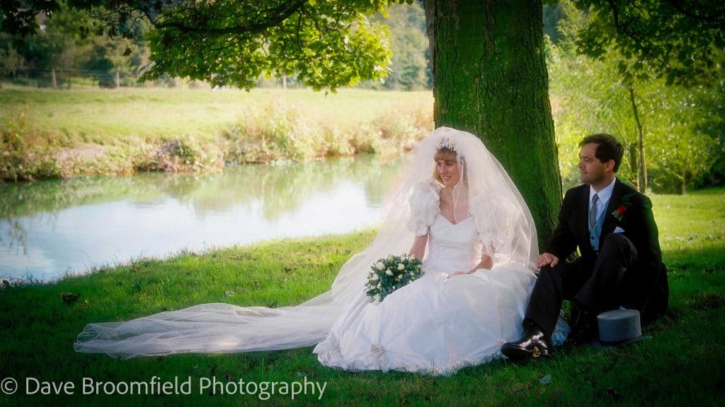 Film Wedding Photography - Image of Bride and Groom by river Frome in Wareham