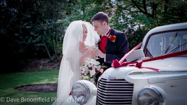 Wedding Photographers in Dorset - Image of Bride and Groom by car