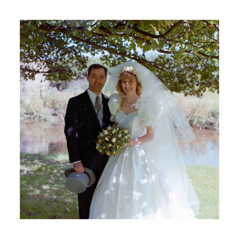 Dorset Wedding Photographer – Image of Bride and Groom underneath trees