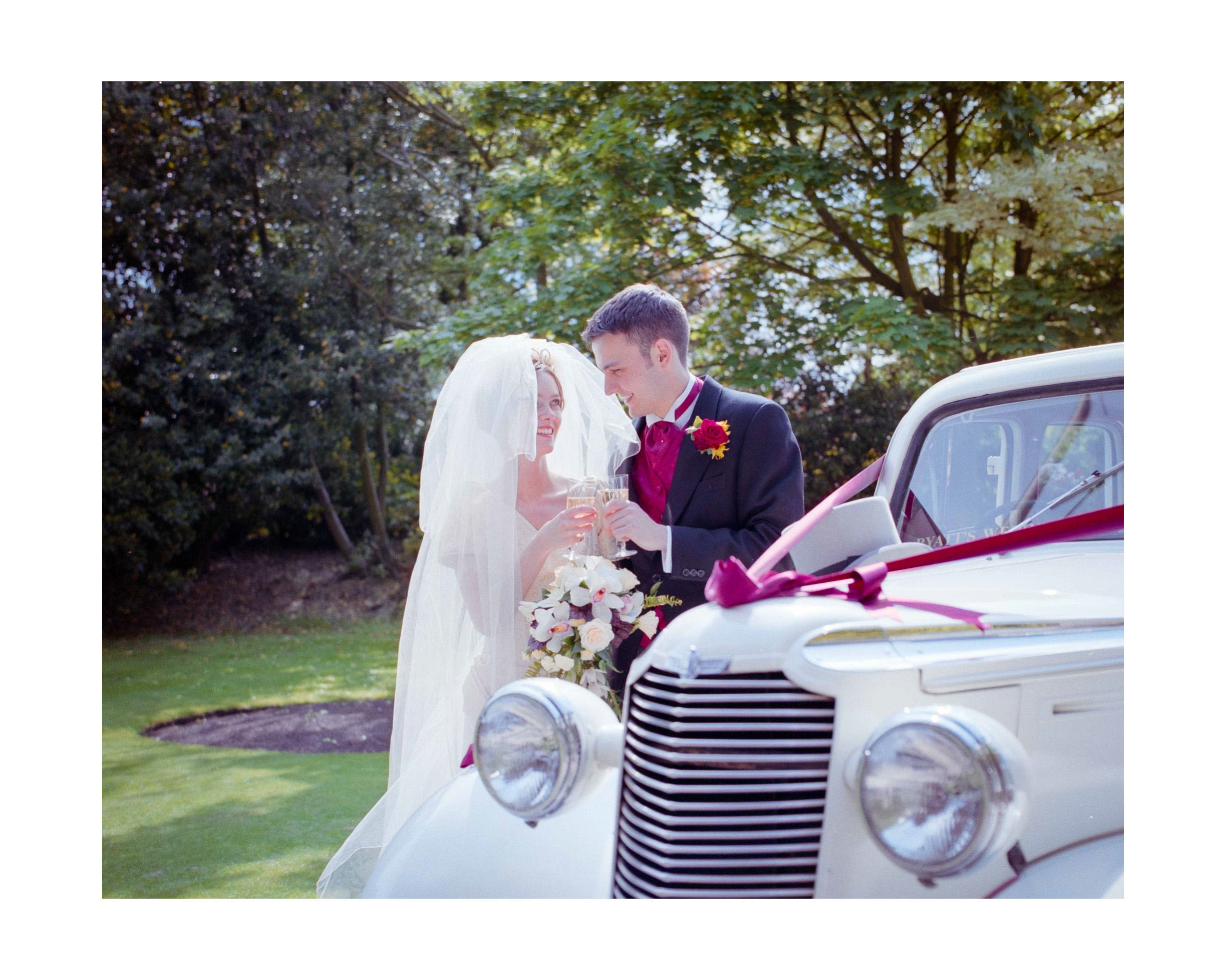 Wedding Photographer in Dorset – Image of Bride and Groom by wedding car
