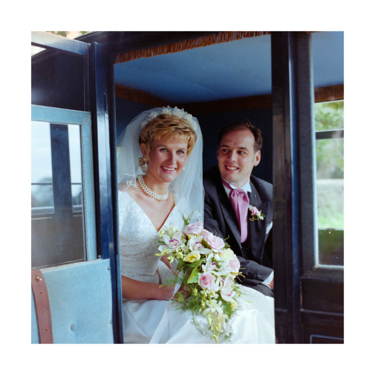 Dorset Wedding Photographer – Image of Bride and Groom in carriage