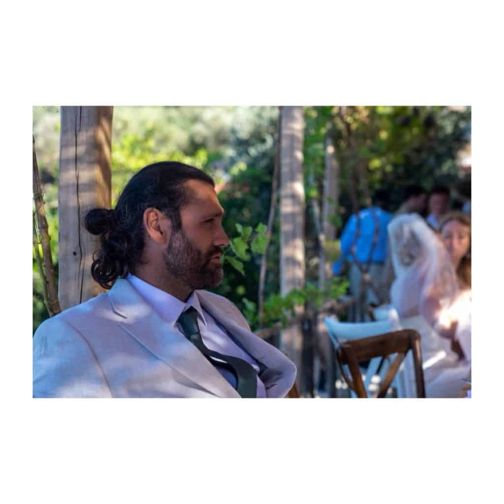 Wedding Photographer in Dorset – Dave Broomfield - Image of guest at Karimalis Winery, Ikaria wedding venue.