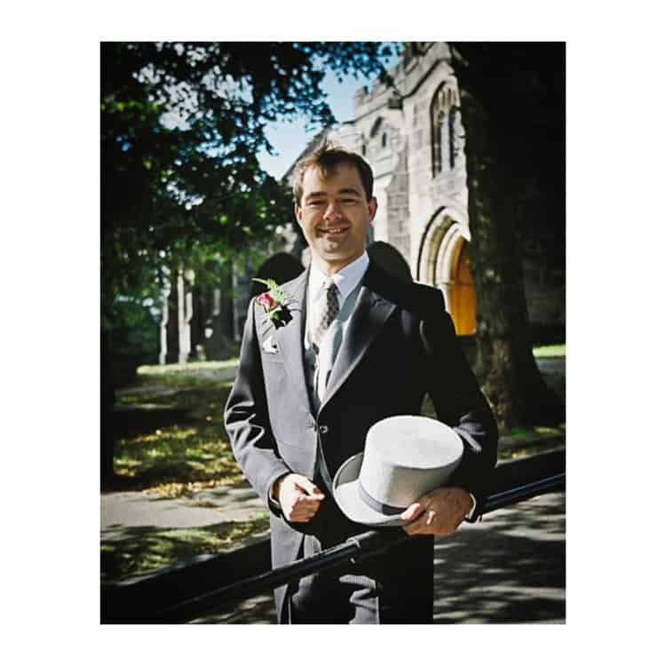 Wedding Photographer in Dorset – Image of Groom outside church